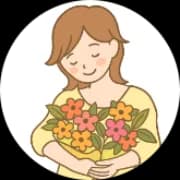 仕立てた花束を抱える女性